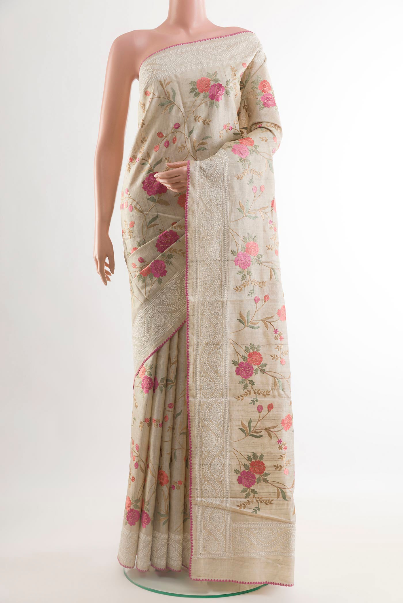 Off White Tussar Saree with Thread Butta on the body and Embroidery Border.  displayed on a mannequin