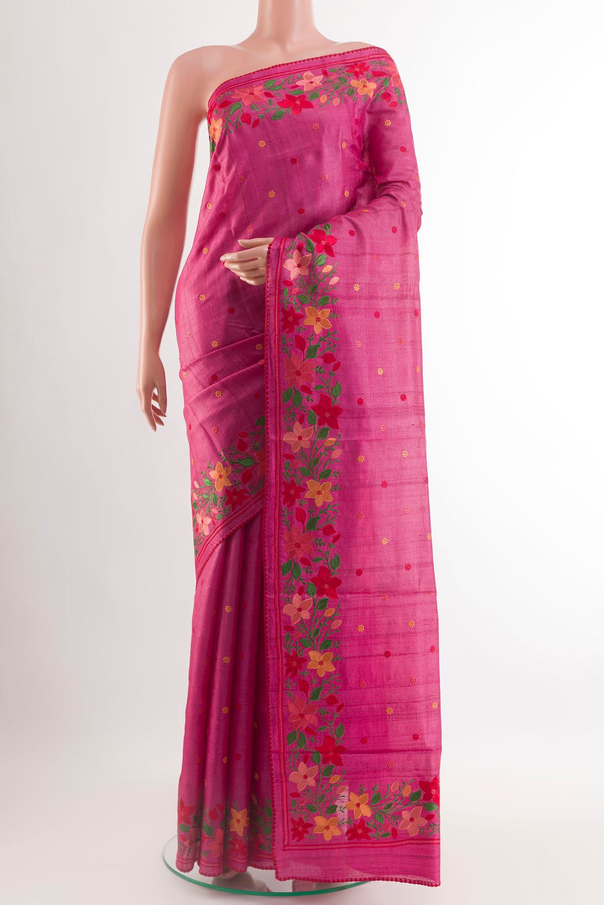Pink Tussar Saree with Embroidery on the body and Embroidery Border.  displayed on a mannequin