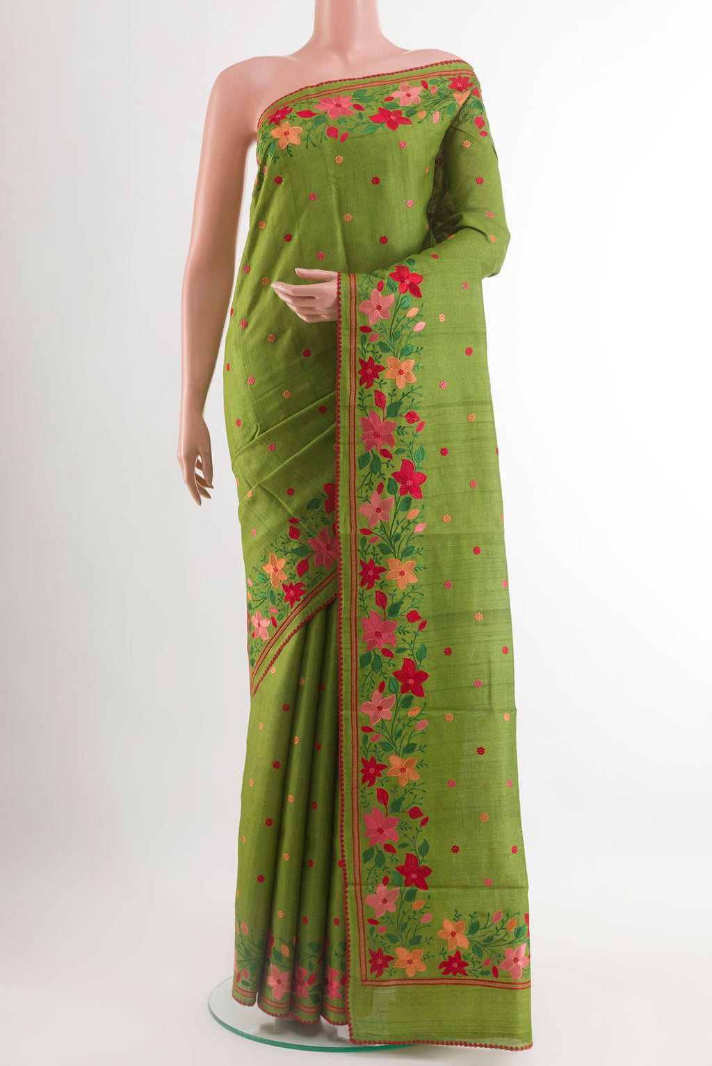Green Tussar Saree with Embroidery on the body and Embroidery Border.  displayed on a mannequin