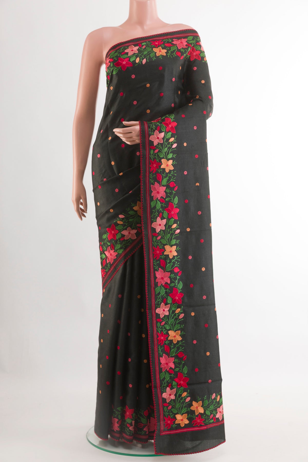 Black Tussar Saree with Thread Butta on the body and Zari Border.  displayed on a mannequin