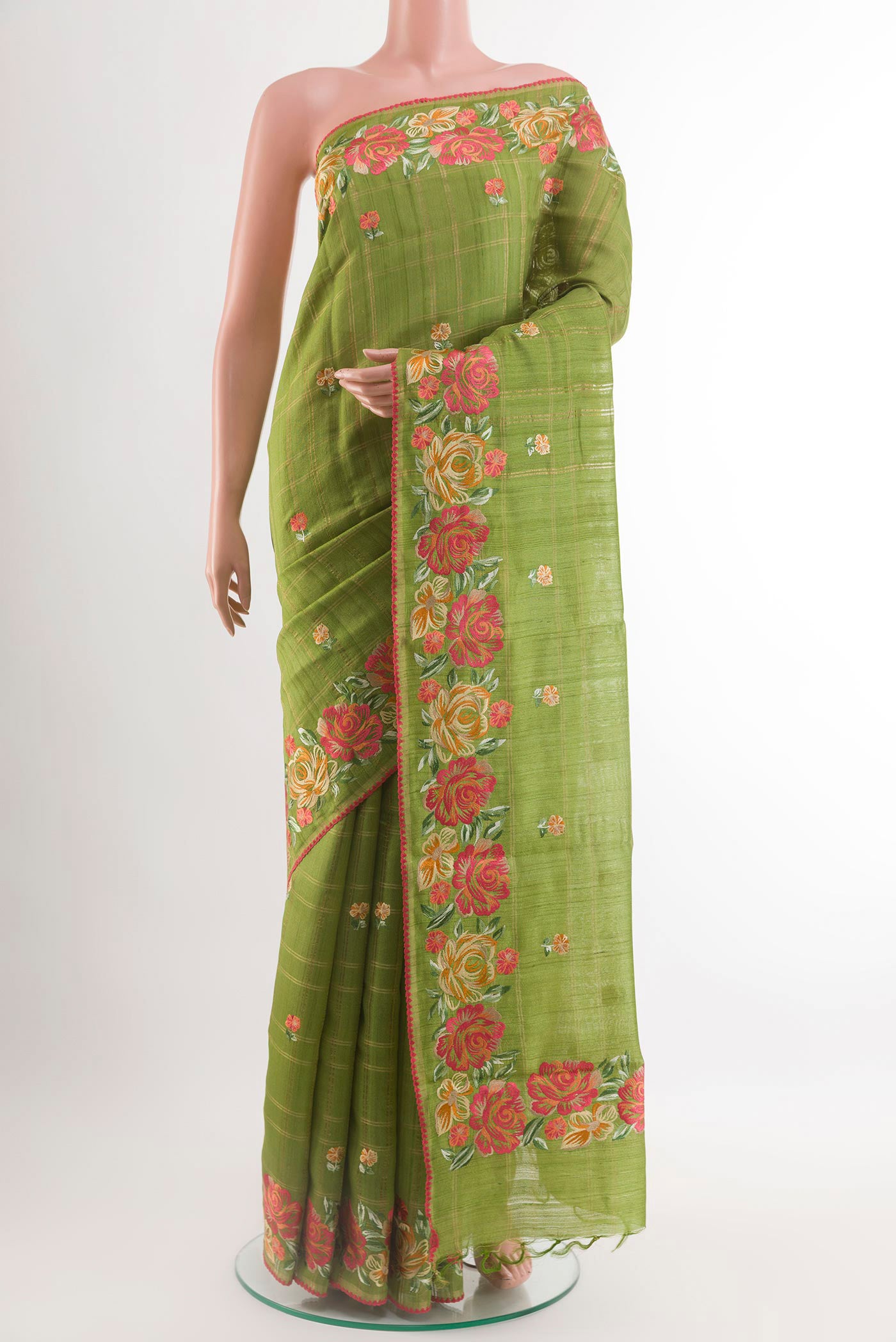 Green Tussar Saree with Embroidery on the body and Embroidery Border.  displayed on a mannequin