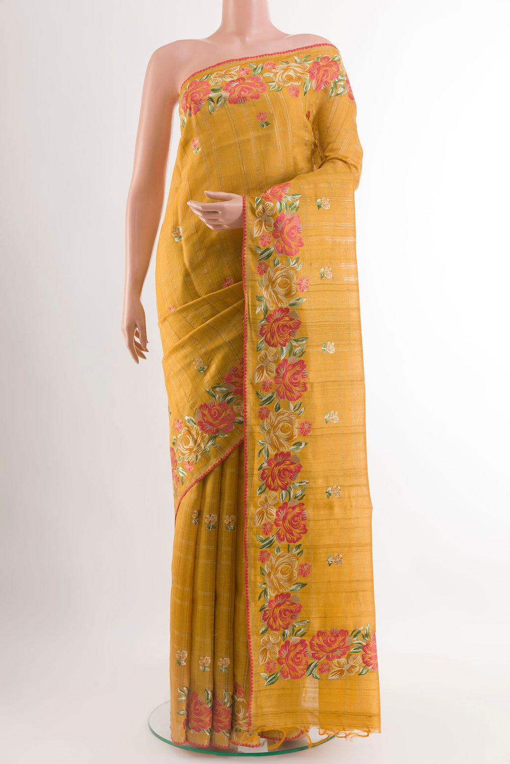 Yellow Tussar Saree with Embroidery on the body and Embroidery Border.  displayed on a mannequin
