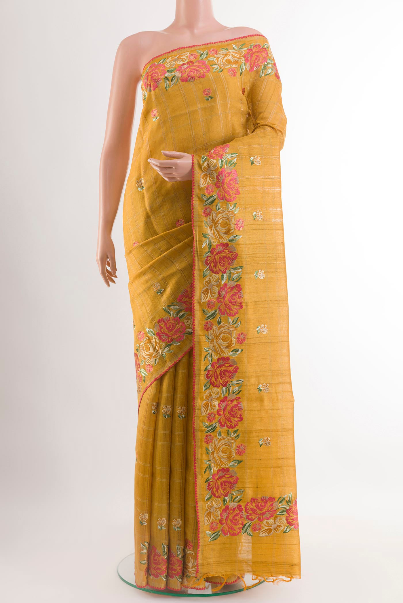 Yellow Tussar Saree with Embroidery on the body and Embroidery Border.  displayed on a mannequin