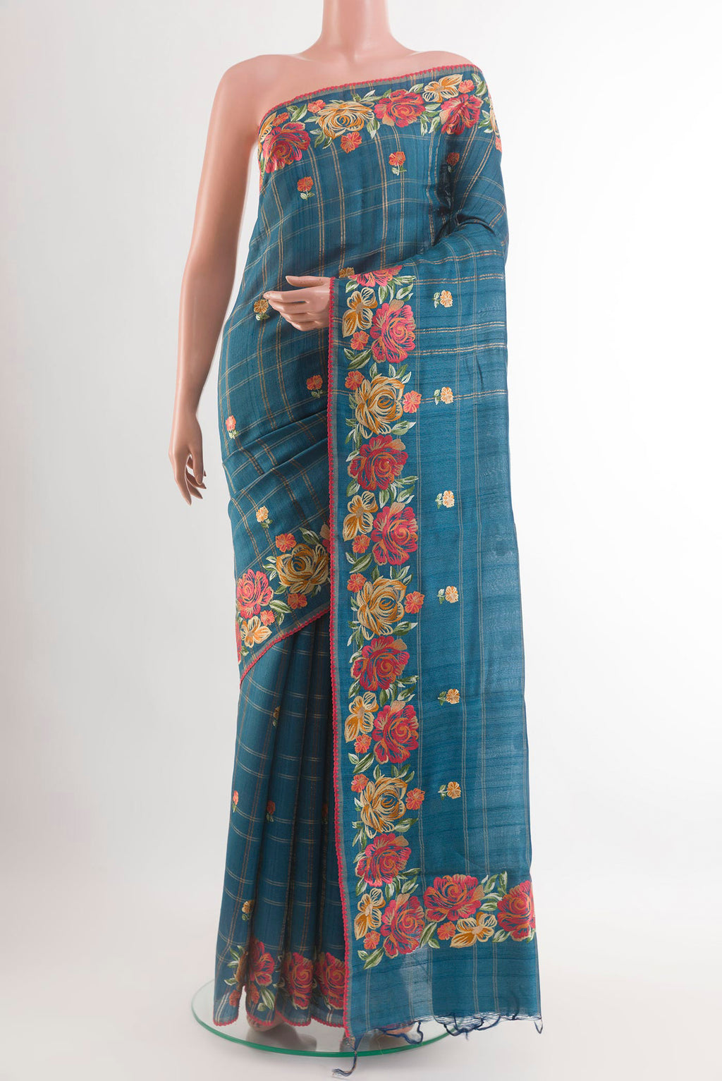 Blue Tussar Saree with Embroidery on the body and Embroidery Border.  displayed on a mannequin