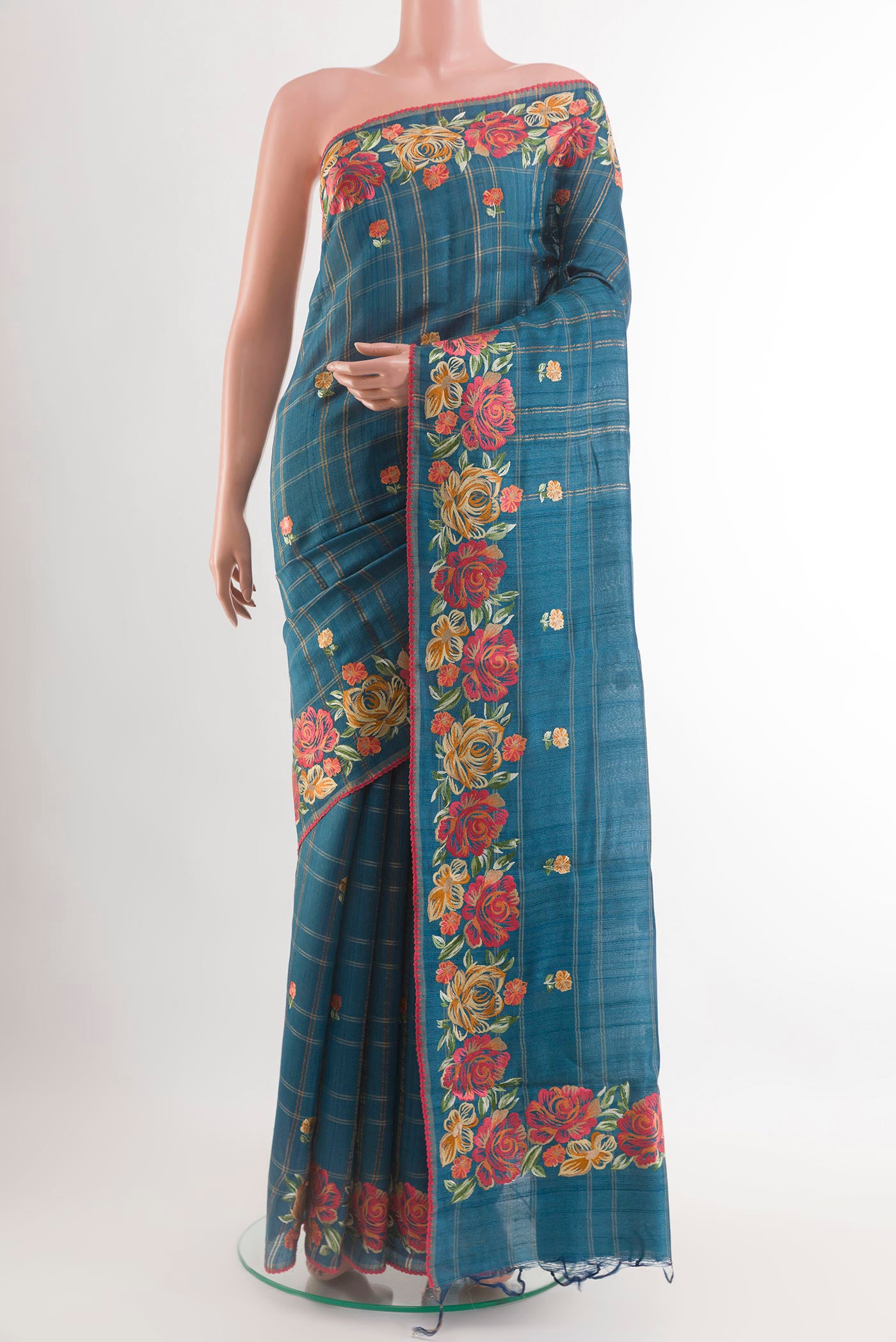 Blue Tussar Saree with Embroidery on the body and Embroidery Border.  displayed on a mannequin