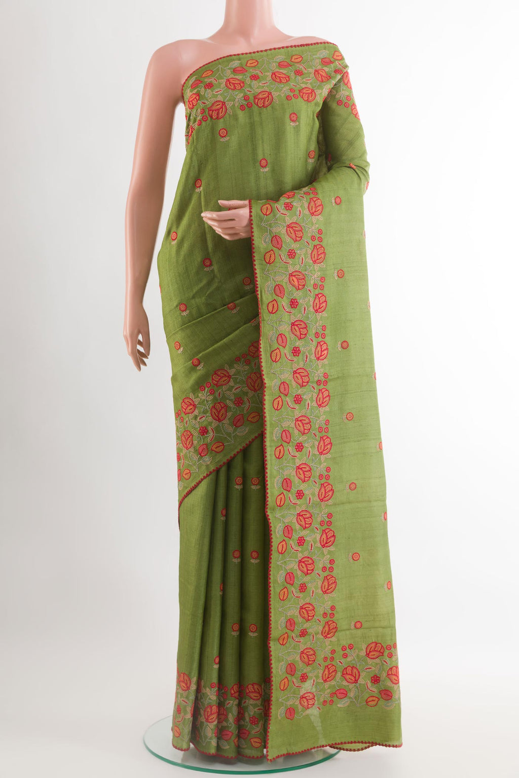 Green Tussar Saree with Thread Butta on the body and Embroidery Border.  displayed on a mannequin