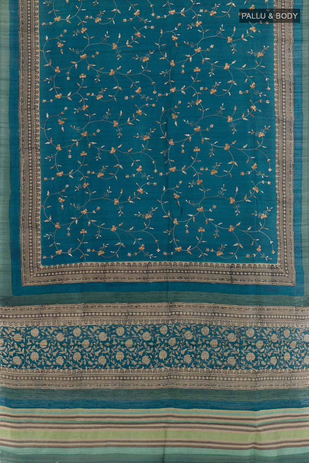 Flat view of Blue Tussar Saree with Embroidery on the body and Embroidery Border. 