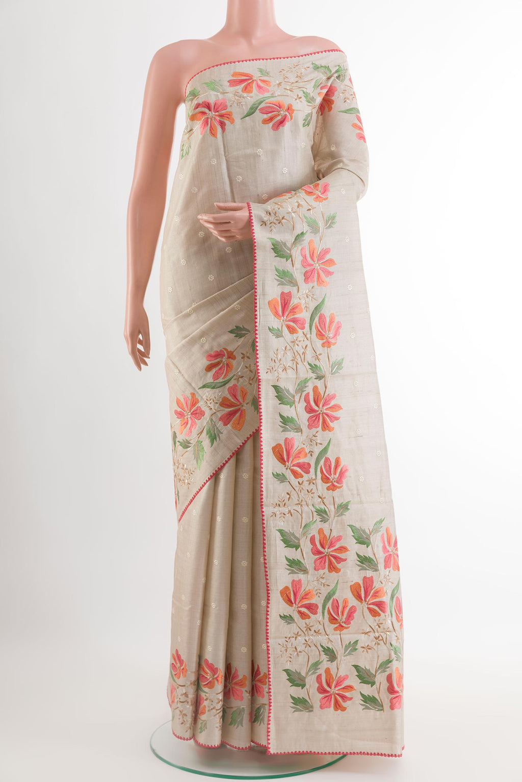 Cream Tussar Saree with Thread Butta on the body and Embroidery Border.  displayed on a mannequin