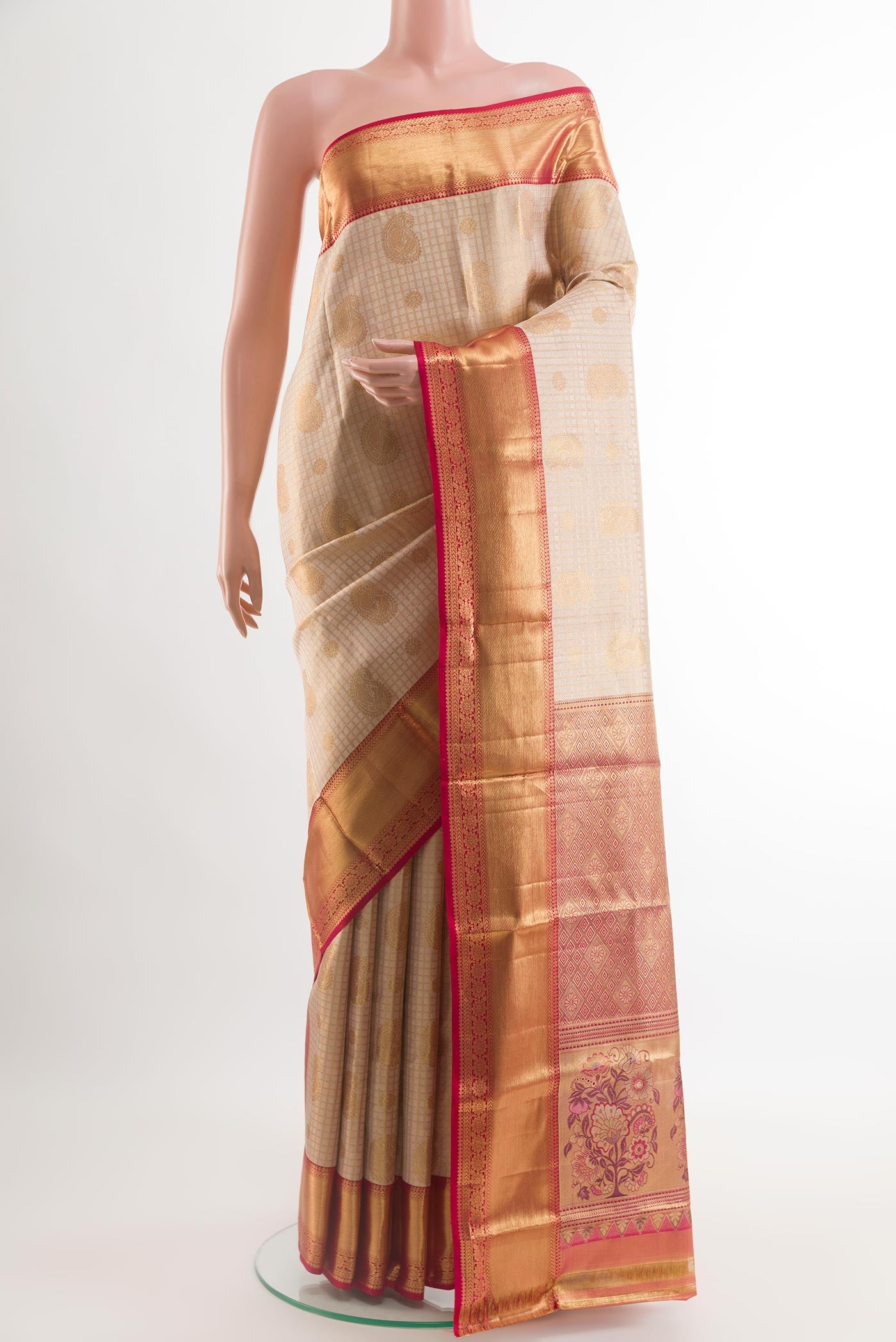 Golden Kanjivaram Silk Saree with Zari Brocade on the body and Zari Border.  displayed on a mannequin