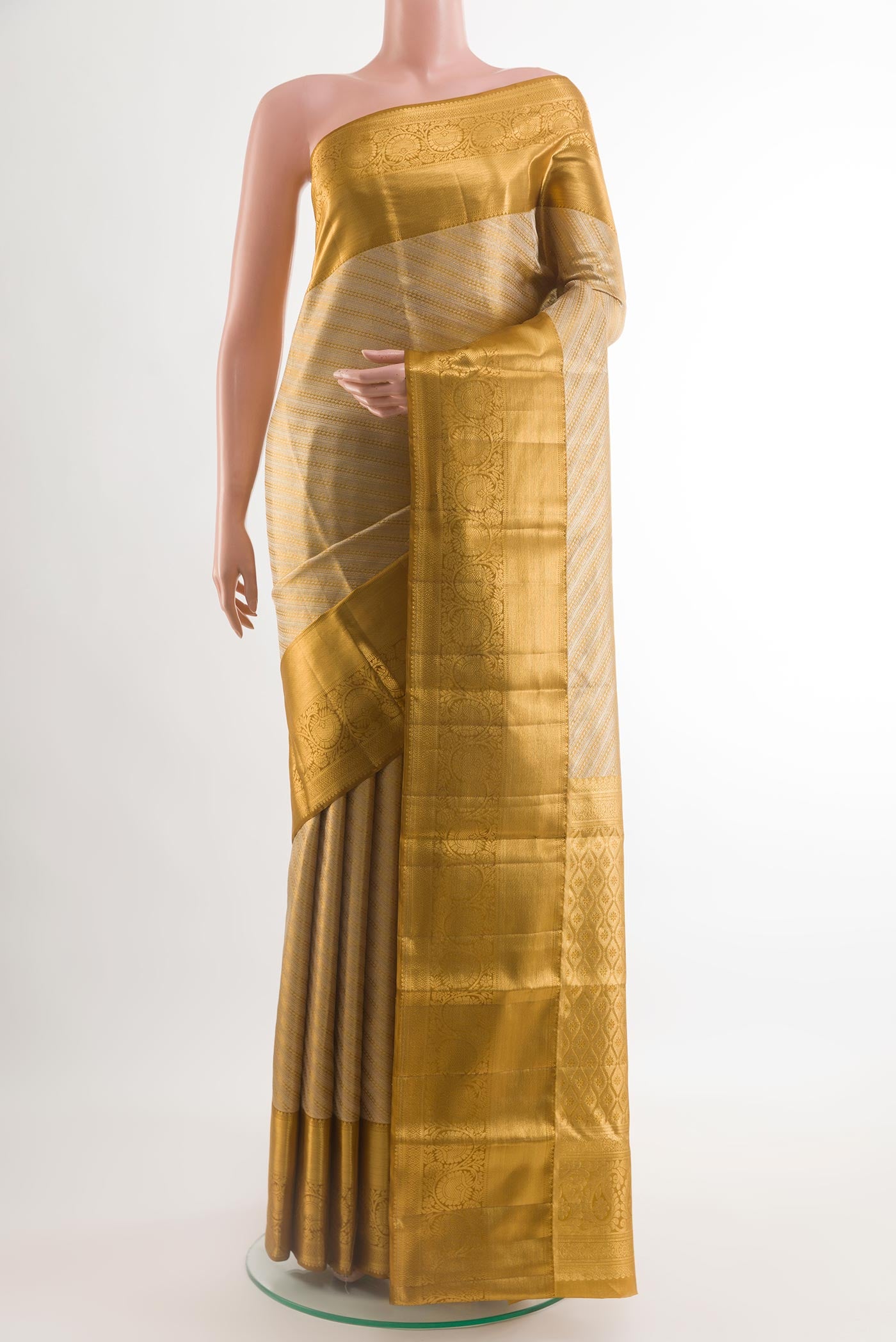 Golden Kanjivaram Silk Saree with Zari Brocade on the body and Paithani Border.  displayed on a mannequin