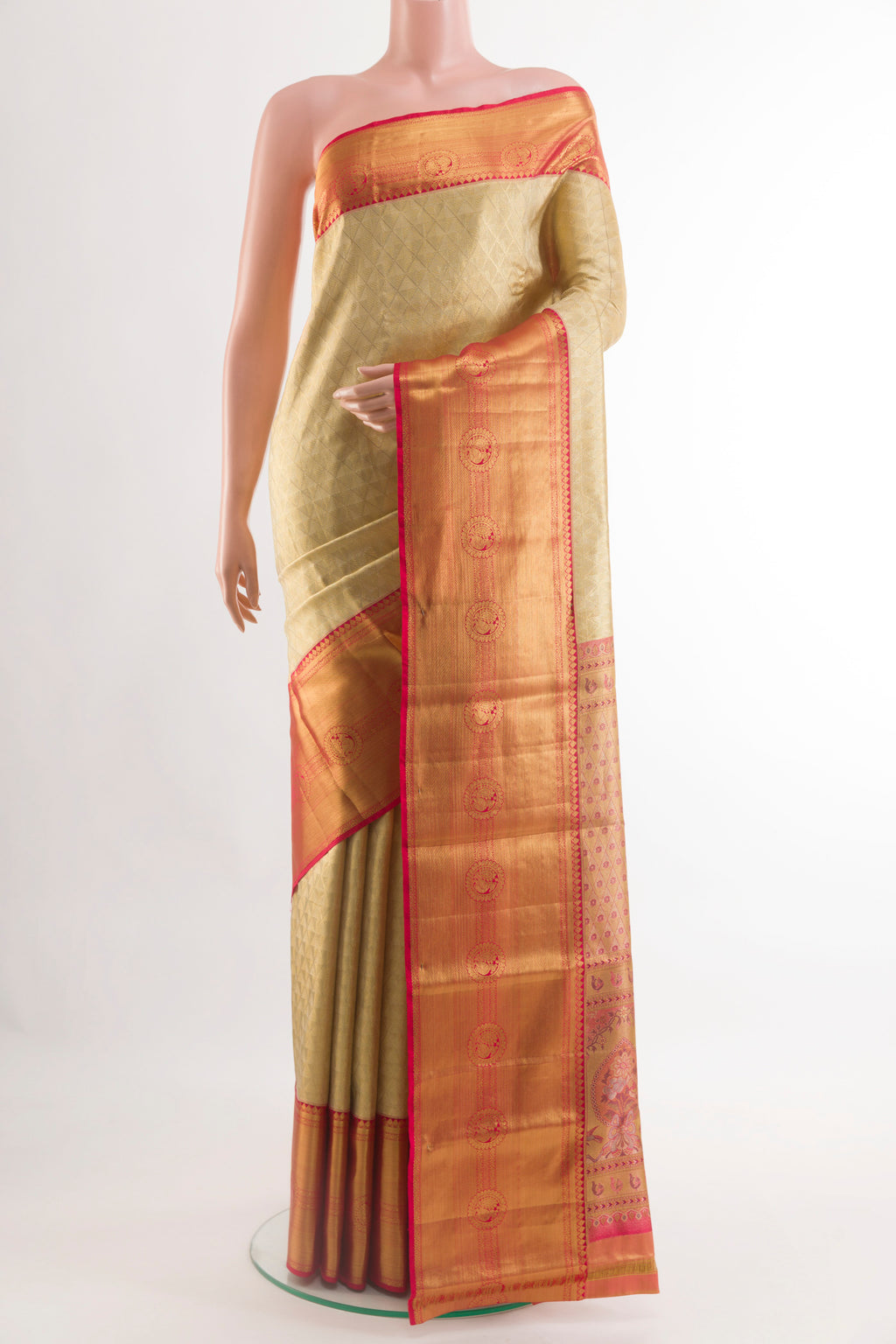 Golden Kanjivaram Silk Saree with Zari Brocade on the body and Zari Border.  displayed on a mannequin
