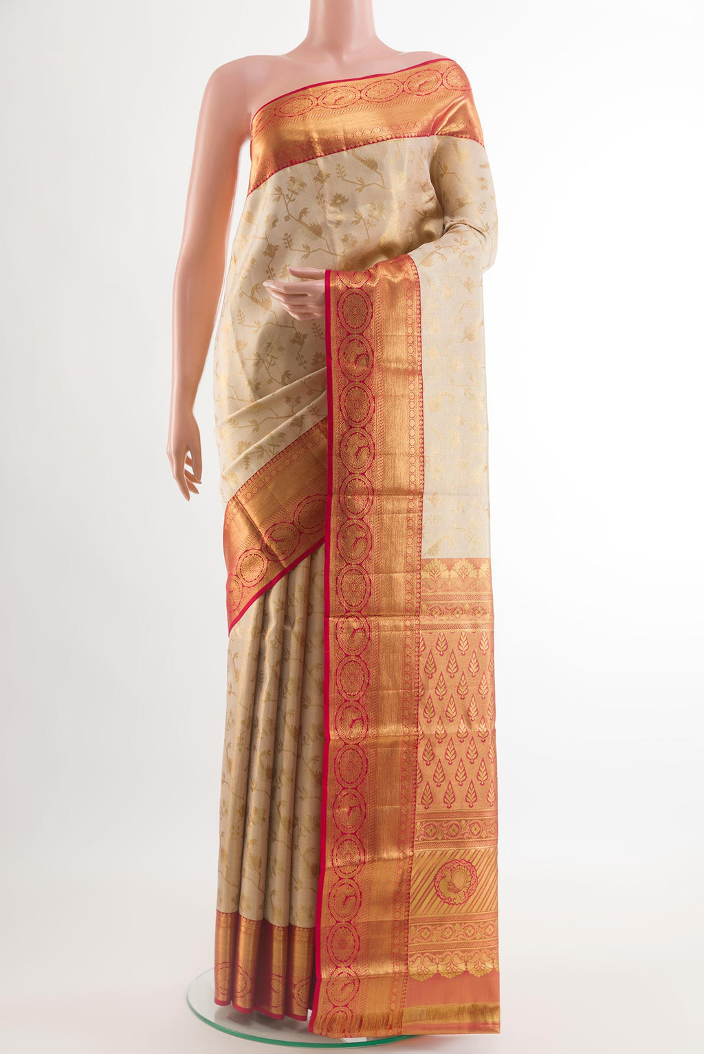 Golden Kanjivaram Silk Saree with Zari Brocade on the body and Zari Border.  displayed on a mannequin