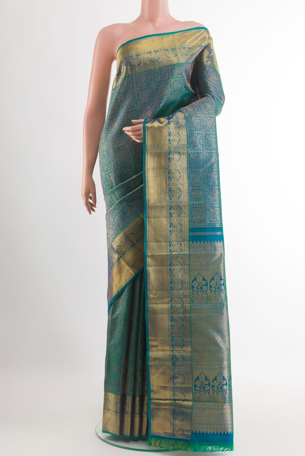 Peacock Blue Kanchipuram Silk Saree with Zari Brocade on the body and Zari Border.  displayed on a mannequin