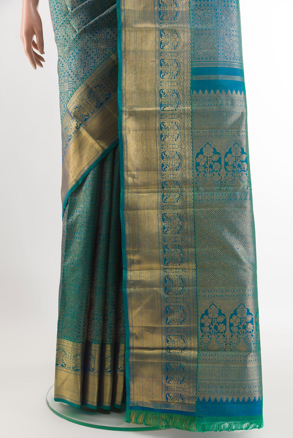 Pleats and pallu of Peacock Blue Kanchipuram Silk Saree with Zari Brocade on the body and Zari Border. 
