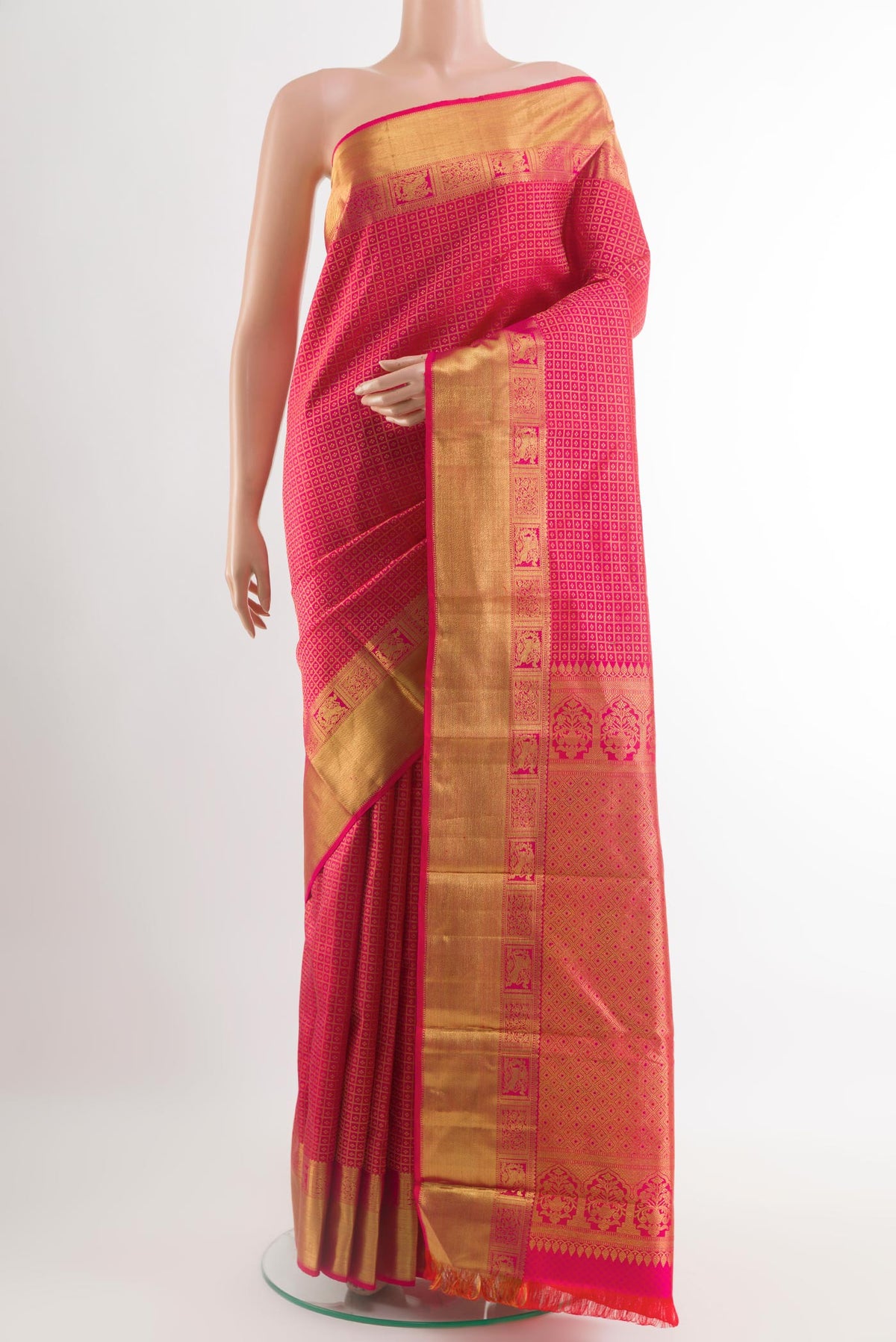 Pink Kanchipuram Silk Saree with Zari Brocade on the body and Zari Border.  displayed on a mannequin