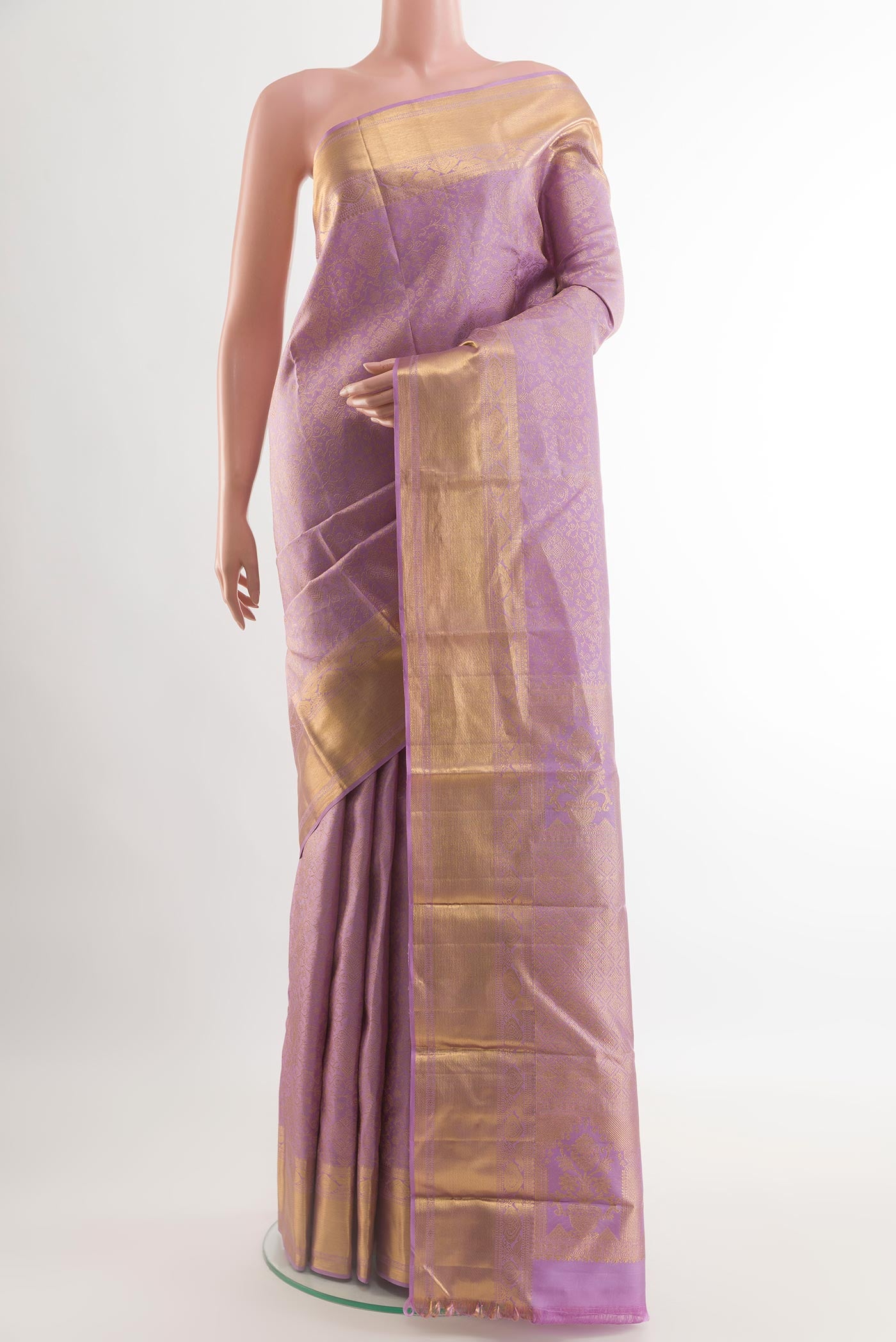 Lavender Kanchipuram Silk Saree with Zari Brocade on the body and Zari Border.  displayed on a mannequin
