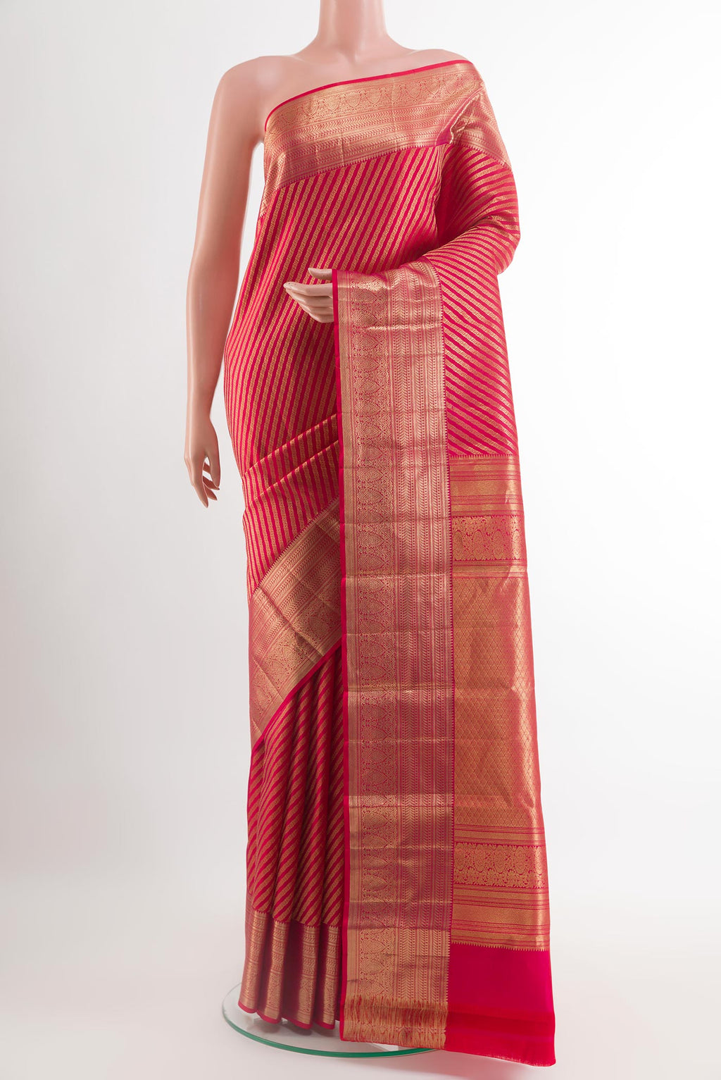 Red Kanchipuram Silk Saree with Stripes on the body and Zari Border.  displayed on a mannequin