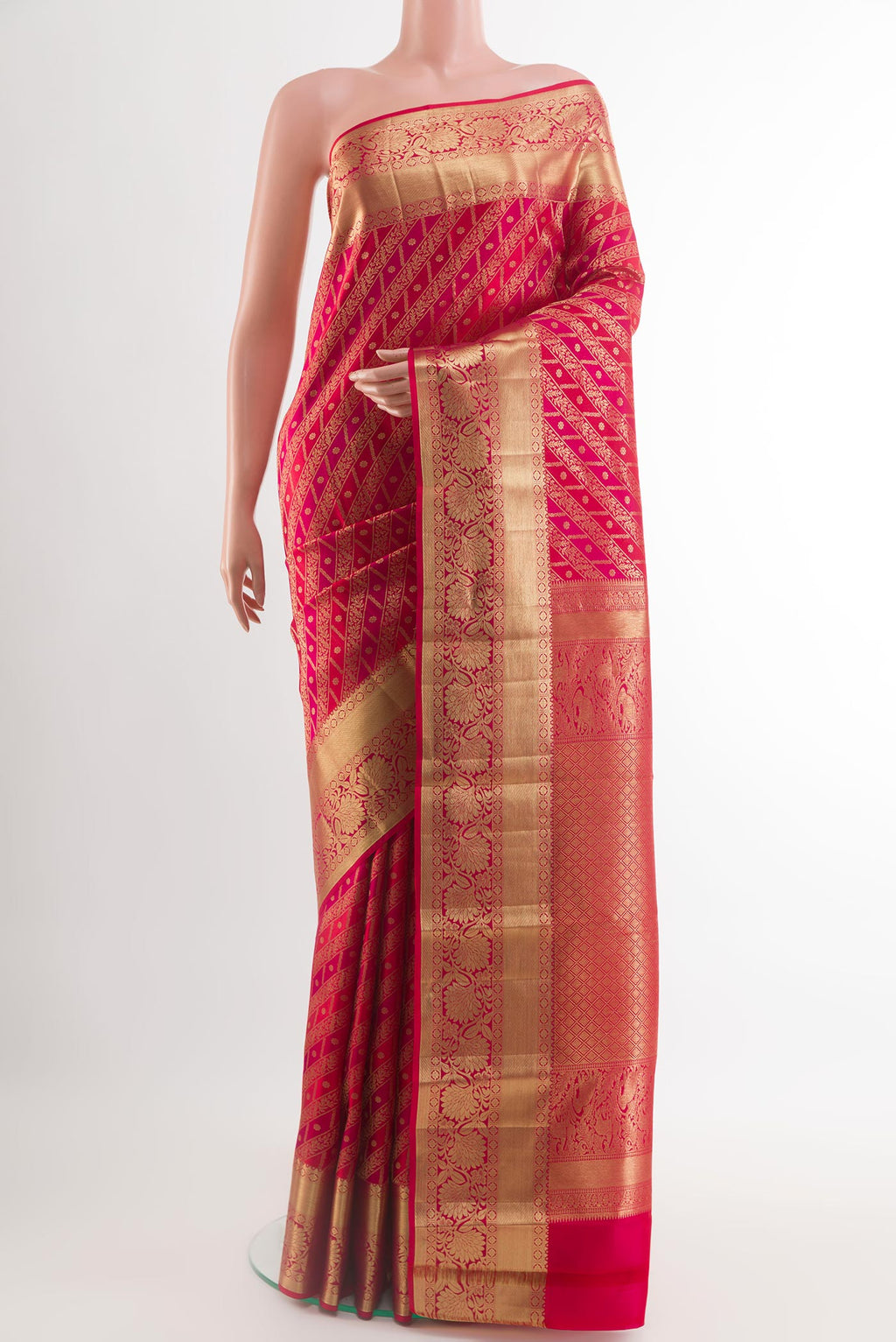 Red Kanchipuram Silk Saree with Zari Brocade on the body and Zari Border.  displayed on a mannequin