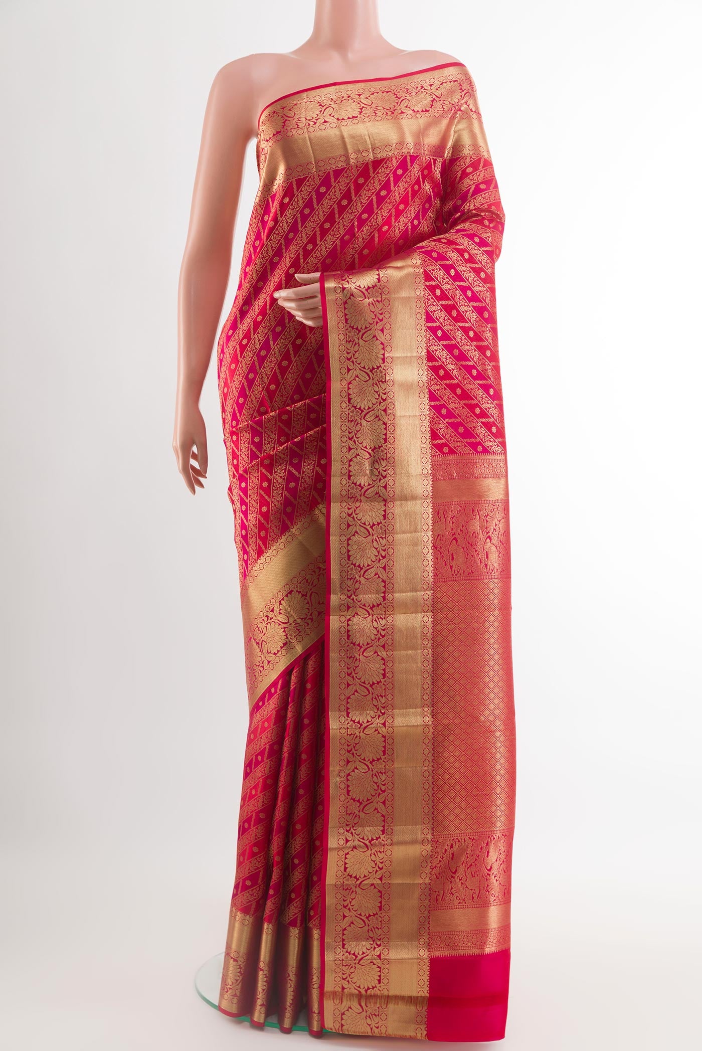 Red Kanchipuram Silk Saree with Zari Brocade on the body and Zari Border.  displayed on a mannequin