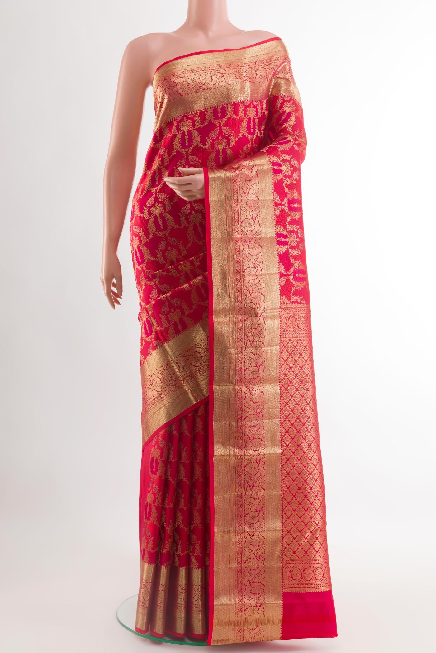 Red Kanchipuram Silk Saree with Zari Brocade on the body and Zari Border.  displayed on a mannequin