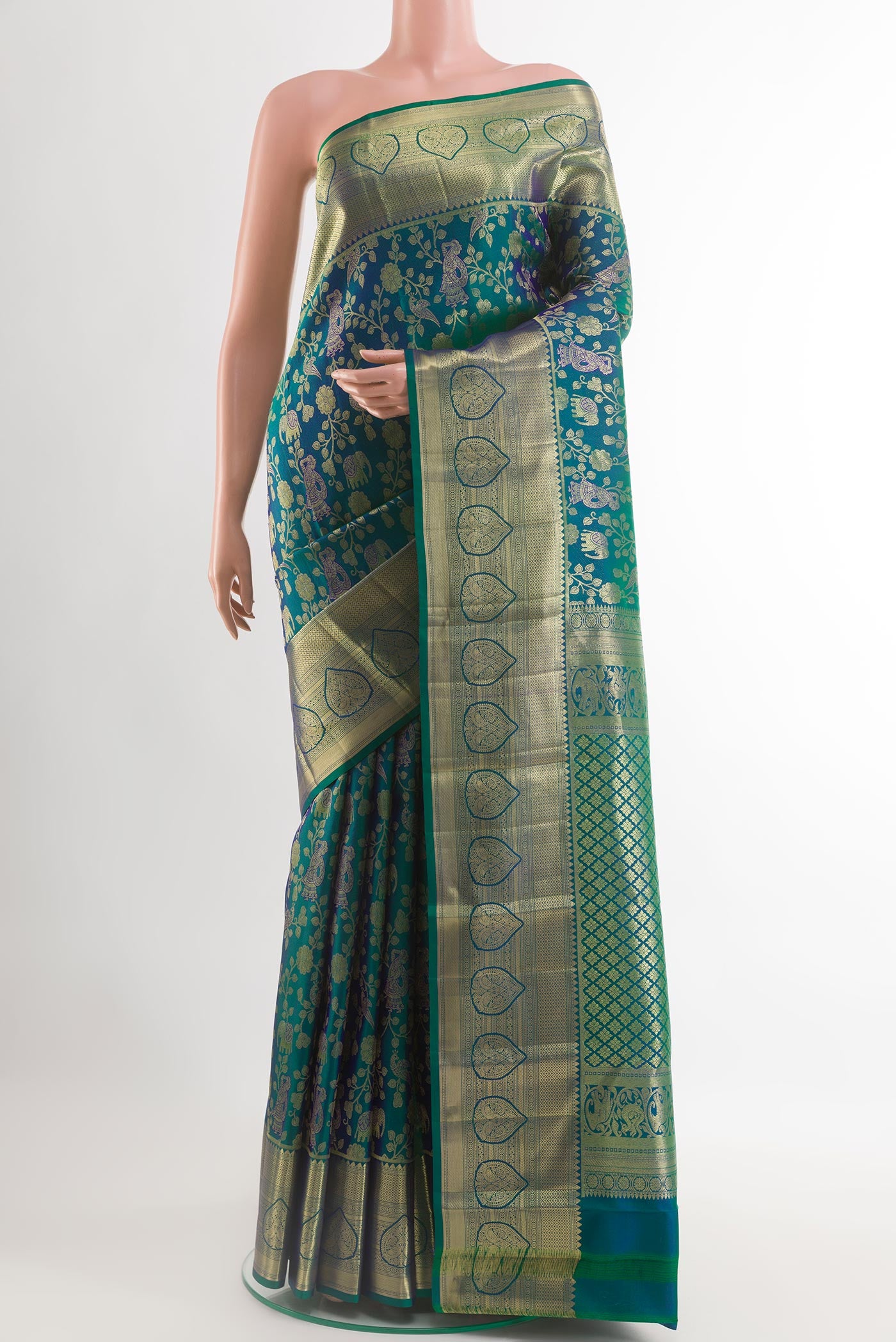 Peacock Blue Kanchipuram Silk Saree with Zari Brocade on the body and Zari Border.  displayed on a mannequin
