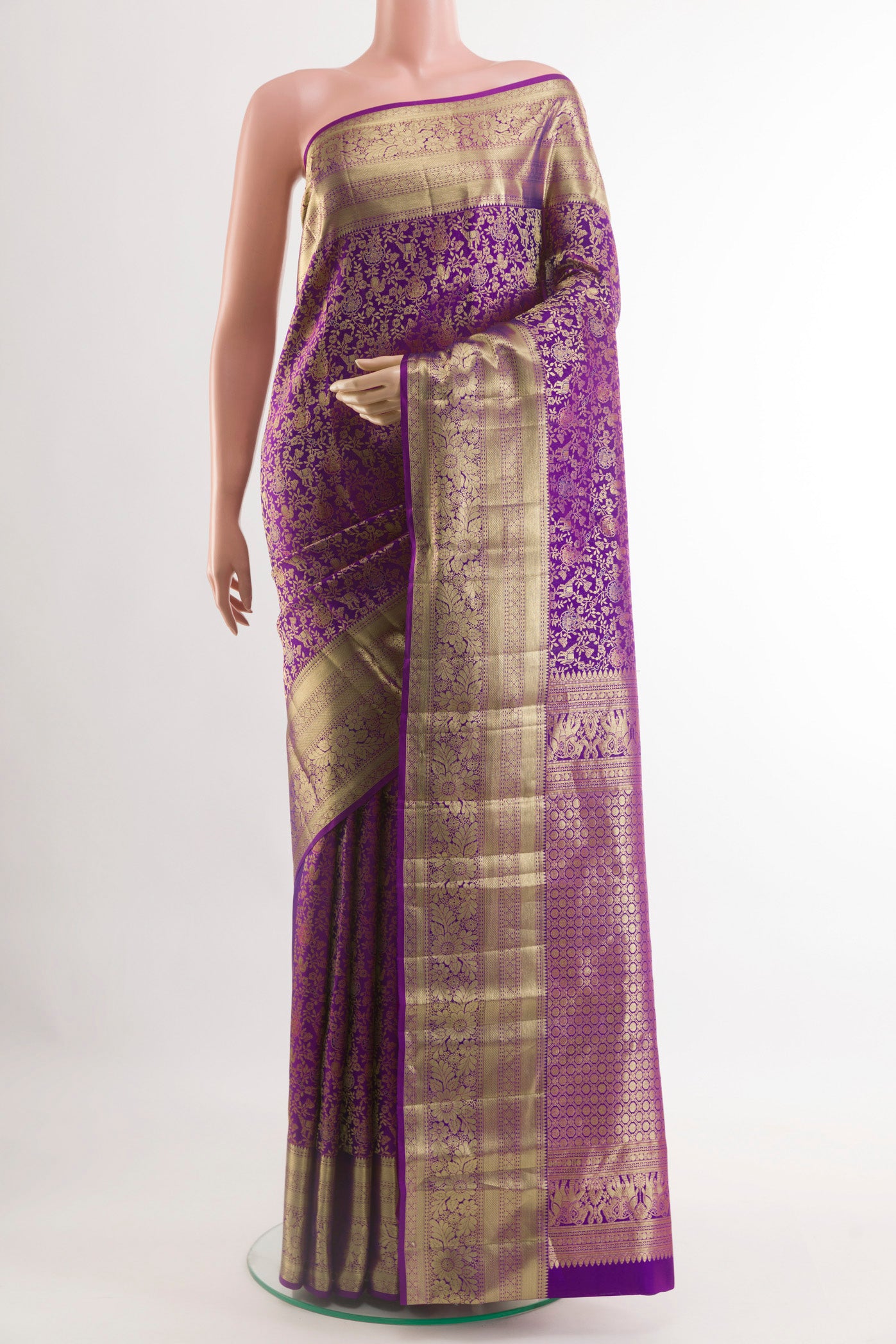 Purple Kanchipuram Silk Saree with Zari Brocade on the body and Zari Border.  displayed on a mannequin