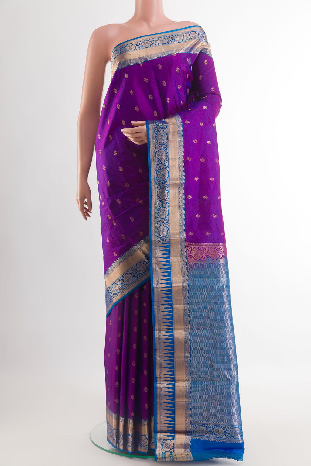 Purple Kanjivaram Silk Saree with Zari Butta on the body and Zari Border.  displayed on a mannequin