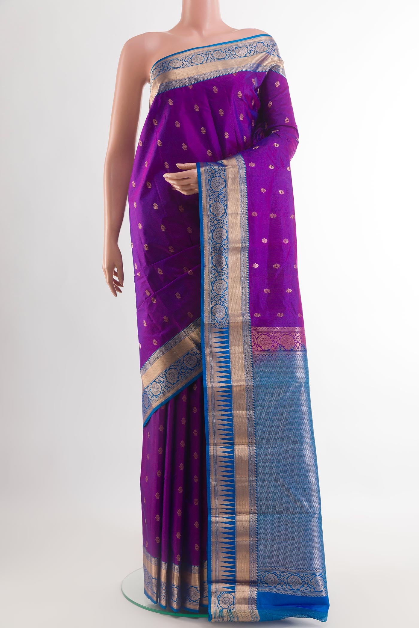 Purple Kanjivaram Silk Saree with Zari Butta on the body and Zari Border.  displayed on a mannequin