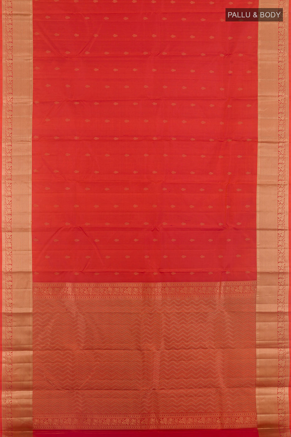 Flat view of Rust Kanjivaram Silk Saree with Zari Butta on the body and Zari Border. 