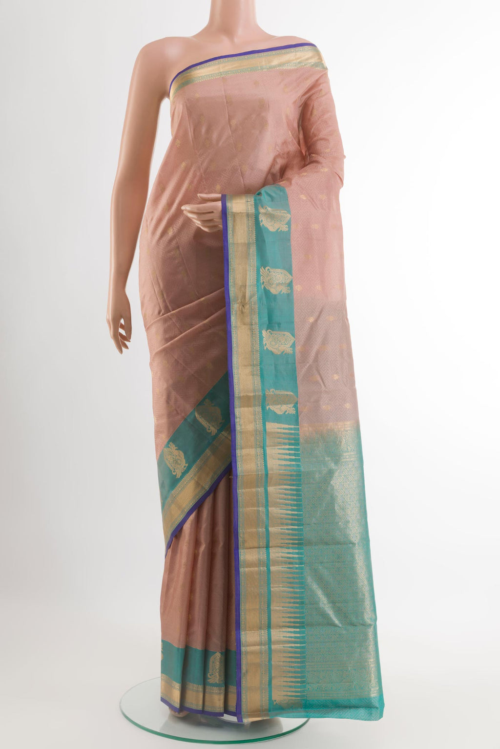 Beige Kanjivaram Silk Saree with Jacquard With Zari Butta on the body and Zari Border.  displayed on a mannequin