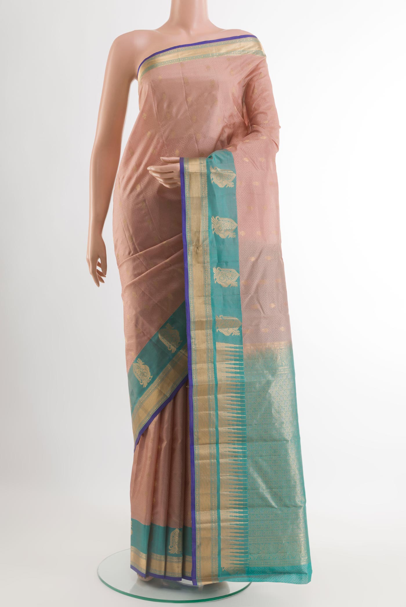 Beige Kanjivaram Silk Saree with Jacquard With Zari Butta on the body and Zari Border.  displayed on a mannequin