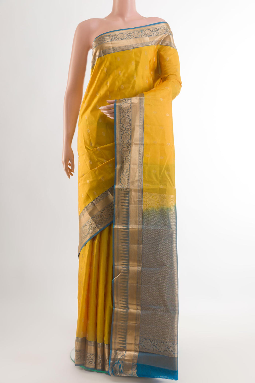 Yellow Kanjivaram Silk Saree with Zari Butta on the body and Zari Border.  displayed on a mannequin
