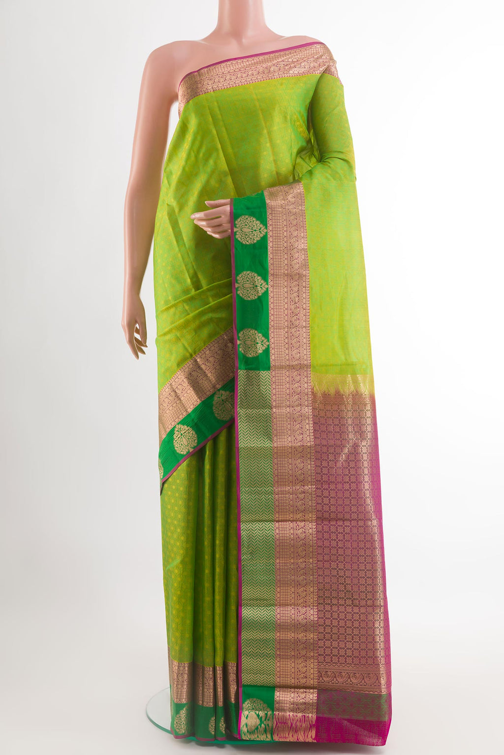 Green Kanjivaram Silk Saree with Jacquard design on the body and Zari Border.  displayed on a mannequin