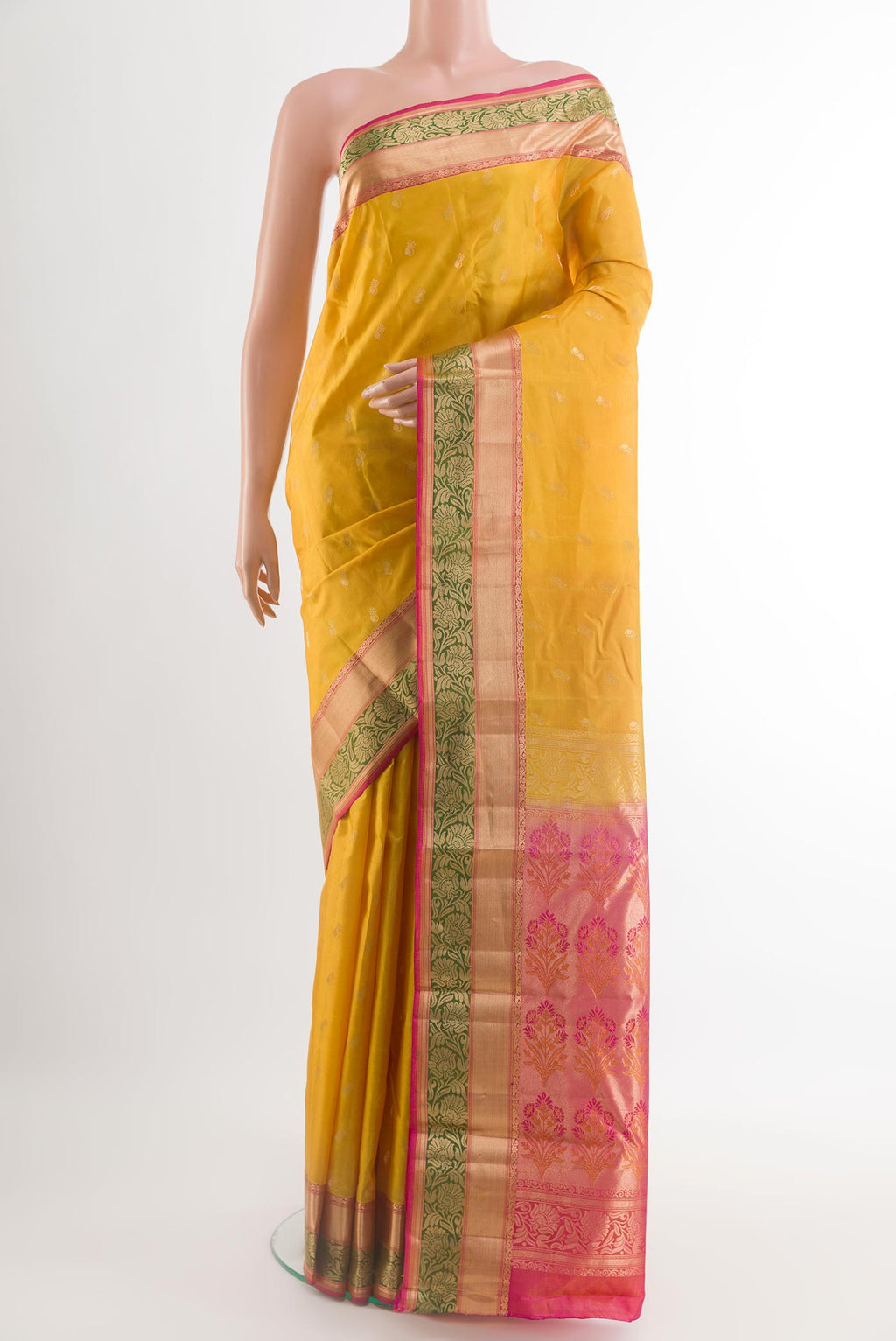 Yellow Kanjivaram Silk Saree with Zari Butta on the body and Zari Border.  displayed on a mannequin