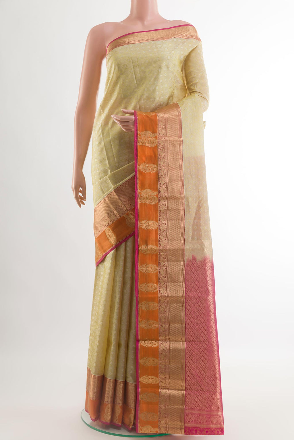 Beige Kanjivaram Silk Saree with Jacquard design on the body and Zari Border.  displayed on a mannequin