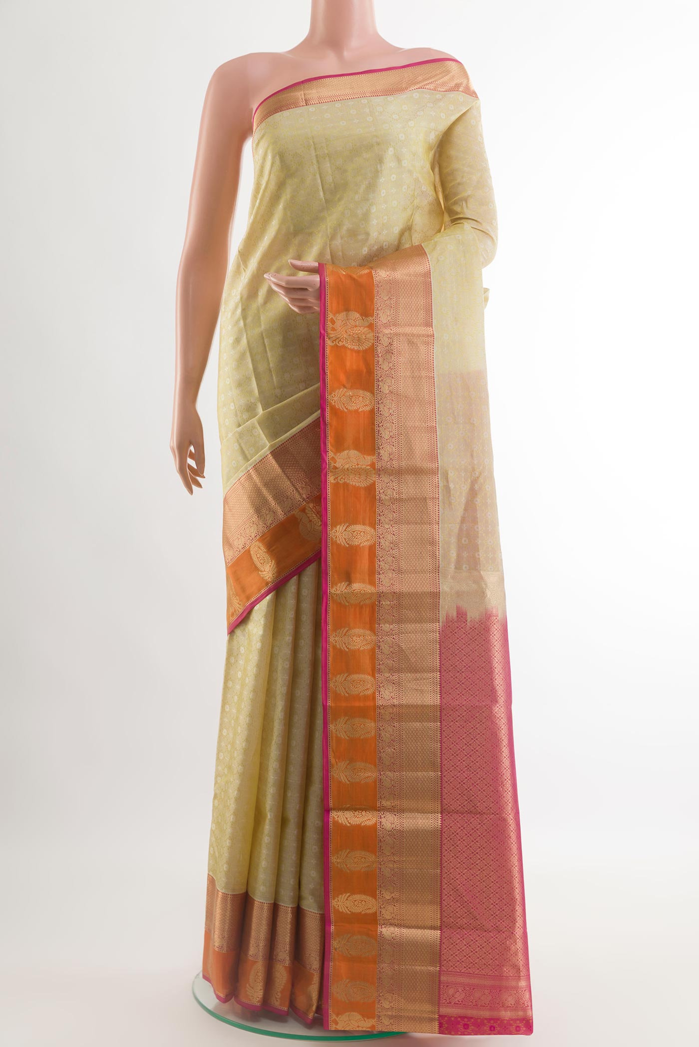 Beige Kanjivaram Silk Saree with Jacquard design on the body and Zari Border.  displayed on a mannequin