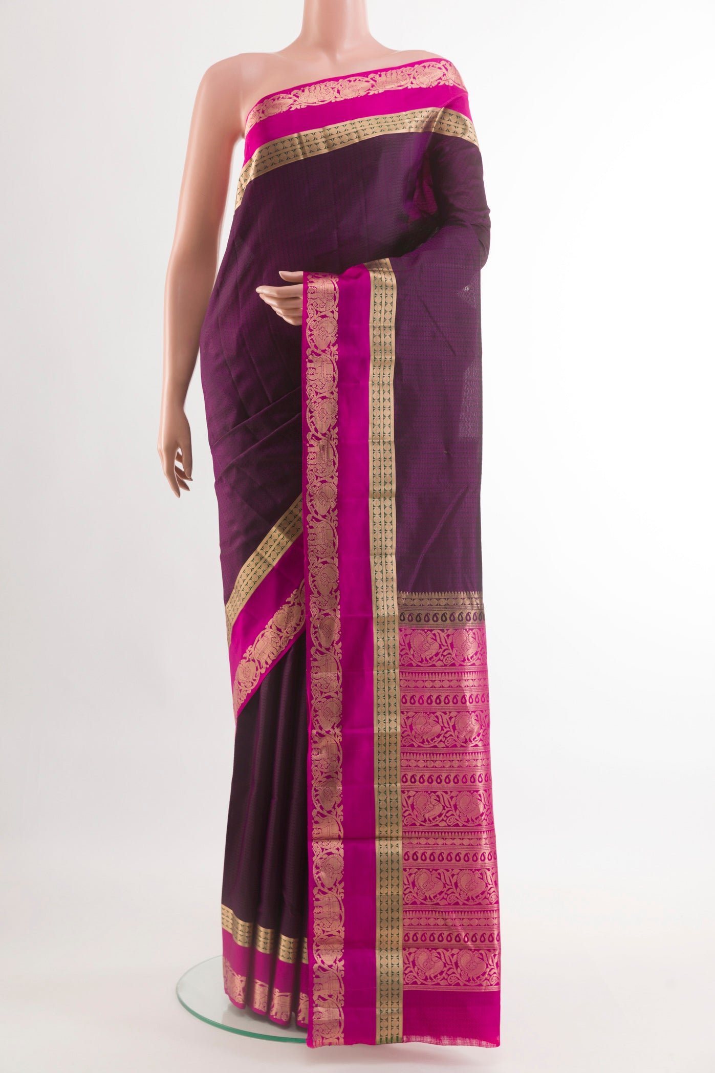 Purple Kanjivaram Silk Saree with Jacquard design on the body and Zari Border.  displayed on a mannequin