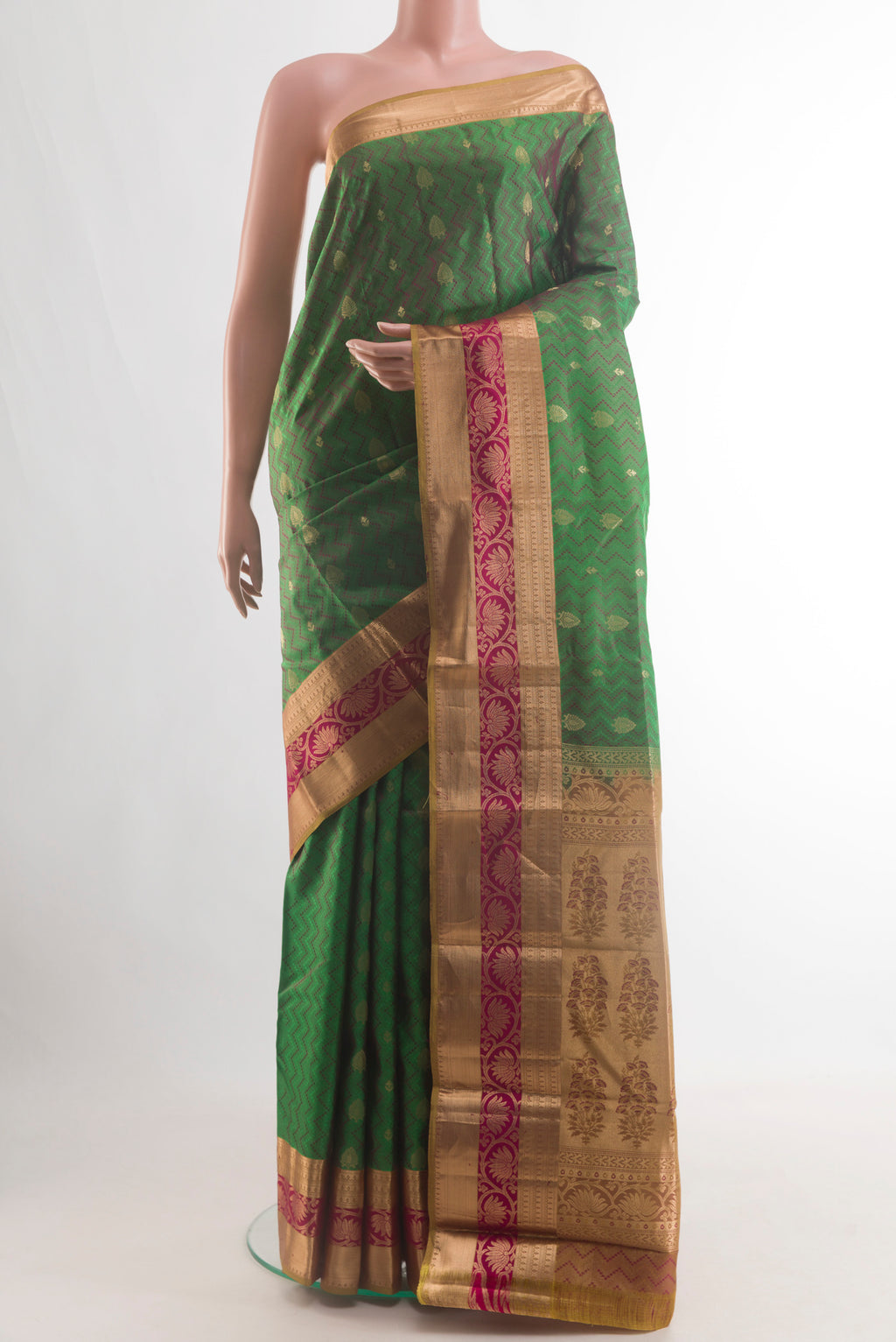 Pure Silk Green Kanjivaram Saree with Jacquard With Zari Butta on the body and Zari Border.  displayed on a mannequin