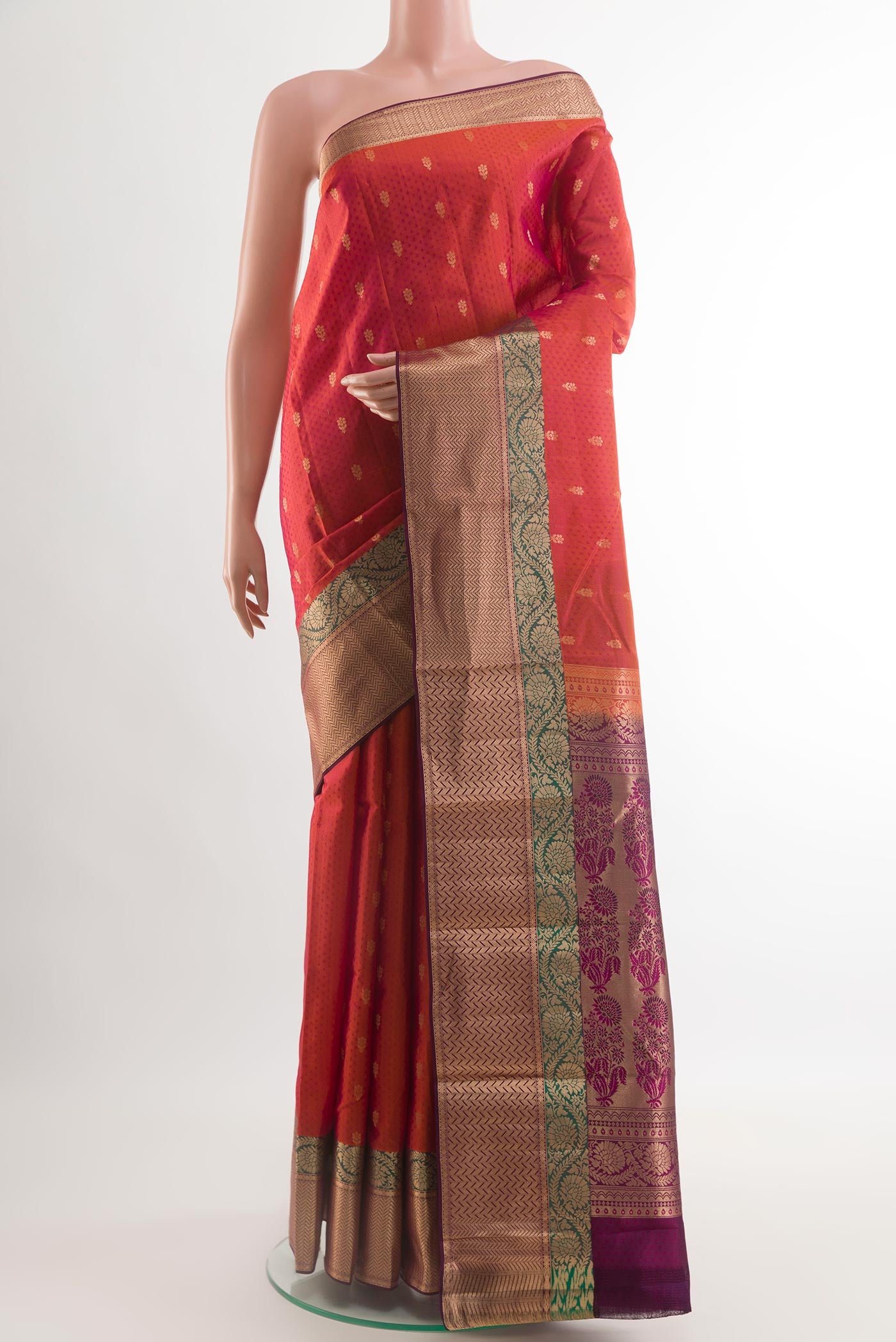 Brick Orange Kanjivaram Silk Saree with Jacquard With Zari Butta on the body and Zari Border.  displayed on a mannequin