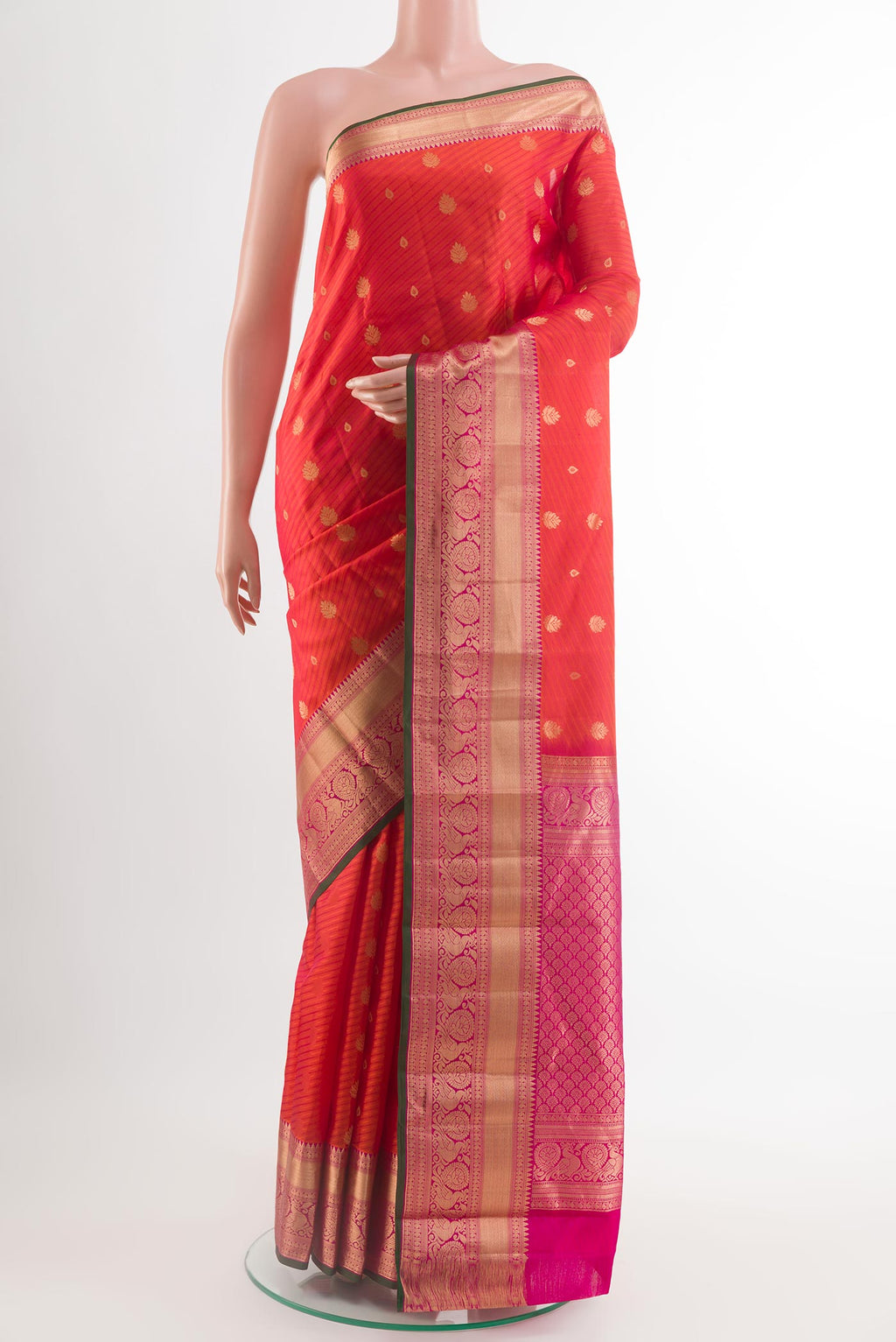 Orange Kanjivaram Silk Saree with Jacquard With Zari Butta on the body and Zari Border.  displayed on a mannequin