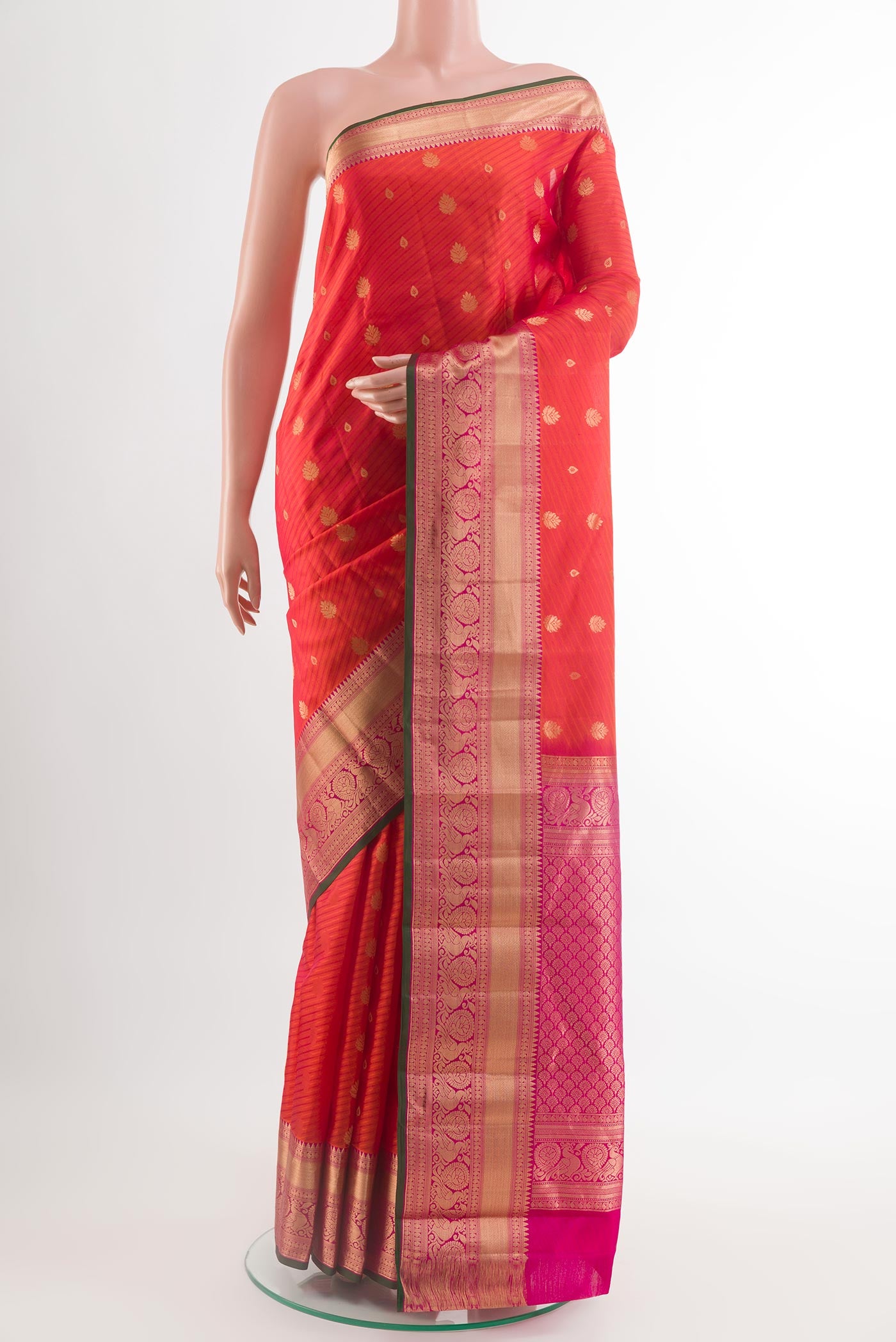 Orange Kanjivaram Silk Saree with Jacquard With Zari Butta on the body and Zari Border.  displayed on a mannequin
