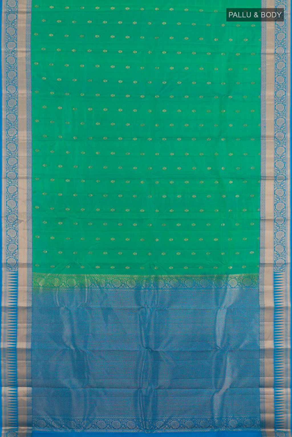 Flat view of Green Kanjivaram Silk Saree with Zari Butta on the body and Zari Border. 