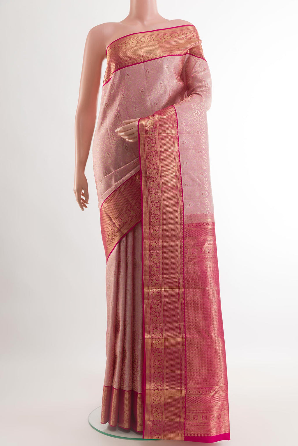 Pink Kanchipuram Silk Saree with Zari Brocade on the body and Zari Border.  displayed on a mannequin