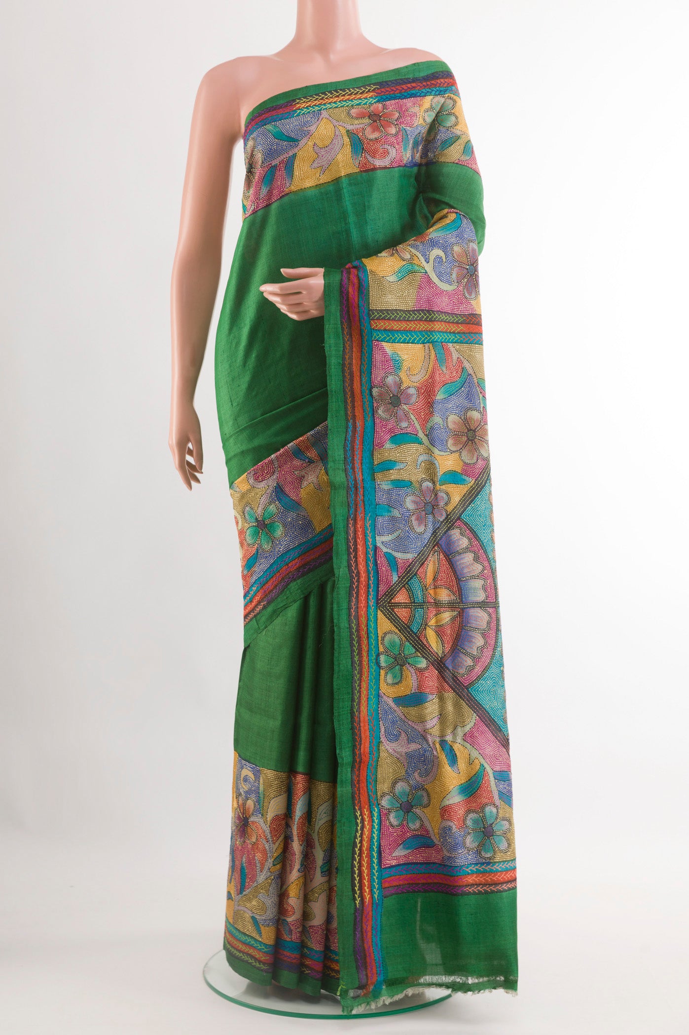Green Tussar Saree with Plain Body and Embroidery Border.  displayed on a mannequin