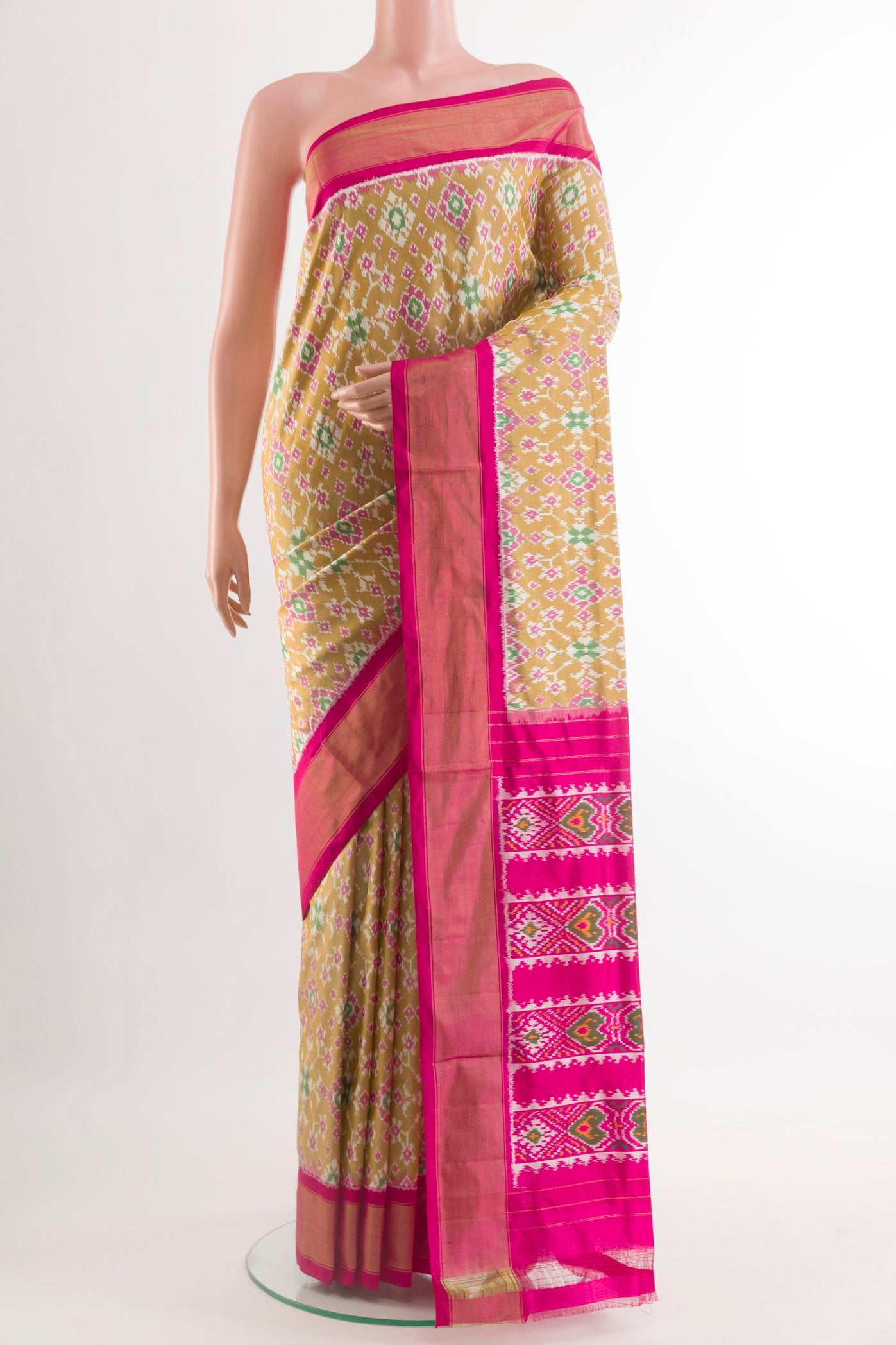 Beige Pochampally Silk Saree with Pure Ikat on the body and Zari Border.  displayed on a mannequin