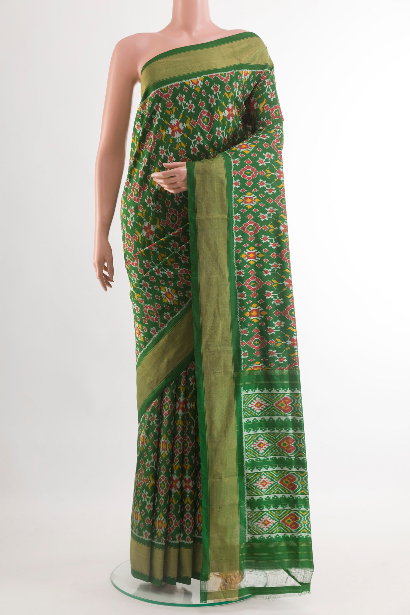 Green Pochampally Silk Saree with Pure Ikat on the body and Zari Border.  displayed on a mannequin