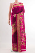 Purple Pochampally Silk Saree with Plain Body and Zari Border.  displayed on a mannequin