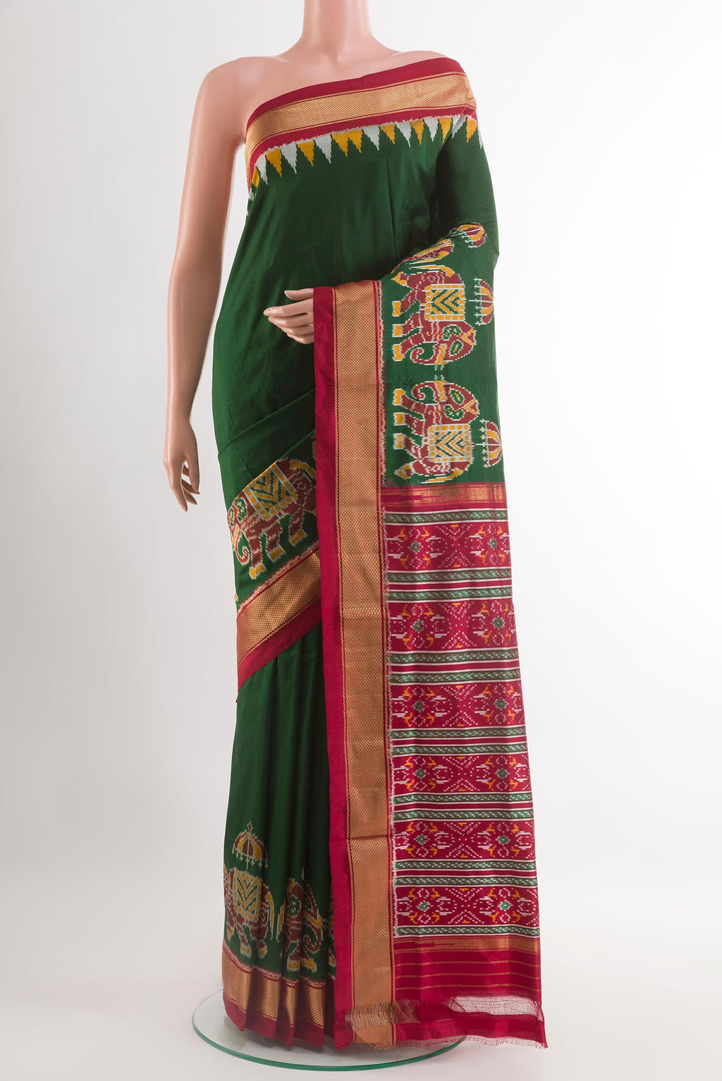 Green Pochampally Silk Saree with Ikat design on the body and Zari Border.  displayed on a mannequin