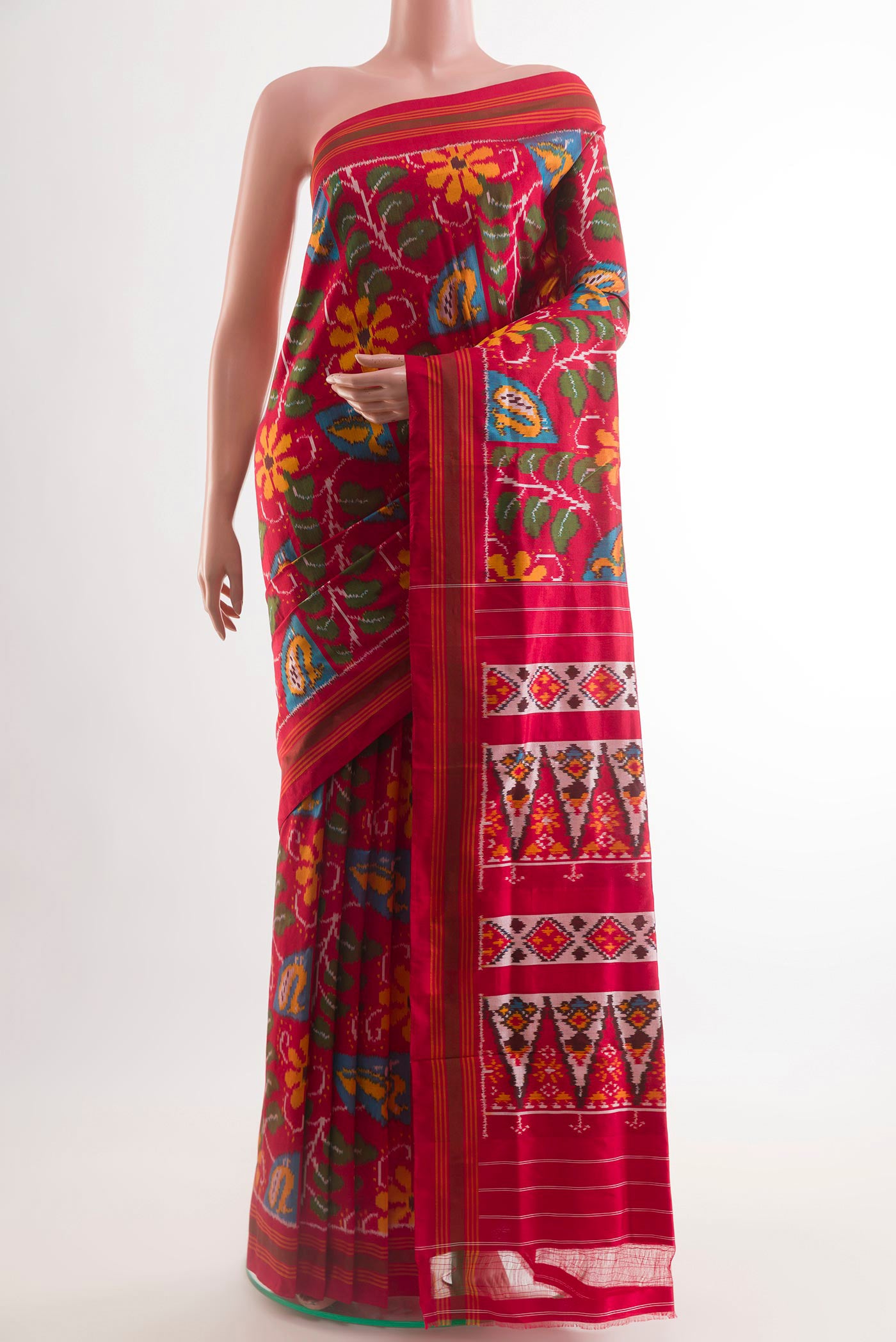Red Pochampally Silk Saree with Ikat design on the body and Zari Border.  displayed on a mannequin