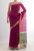 Magenta Chanderi Cotton Saree with Zari Butta on the body and Zari Border.  displayed on a mannequin